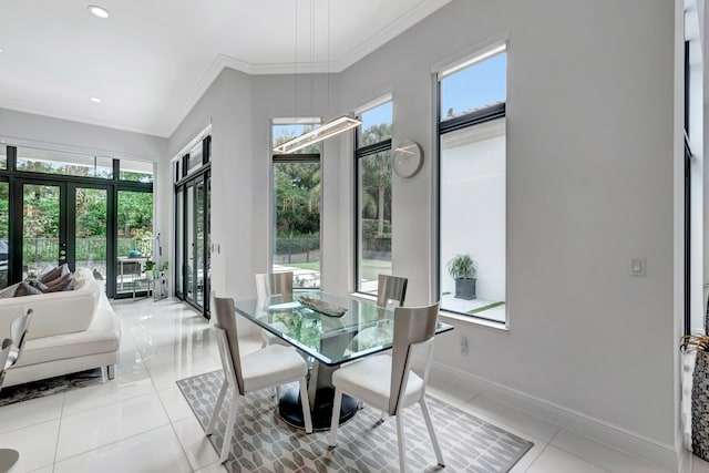 tiled dining area featuring french doors and ornamental molding