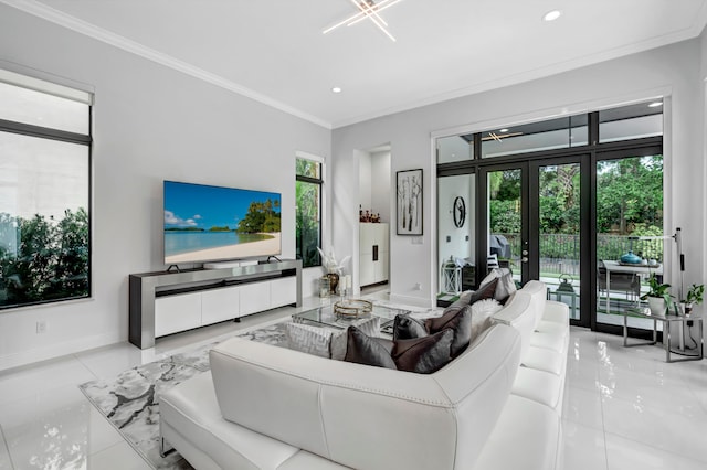 tiled living room with crown molding and french doors