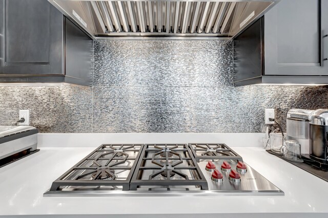 kitchen featuring stainless steel gas cooktop and decorative backsplash