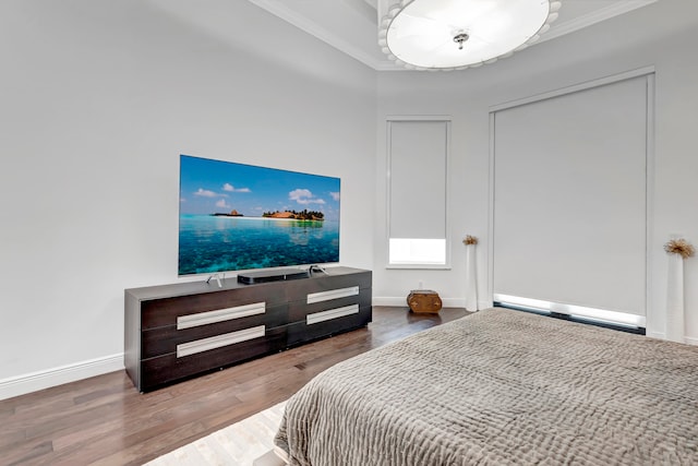 bedroom featuring hardwood / wood-style flooring and ornamental molding