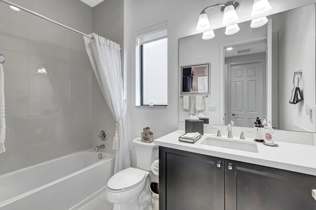 full bathroom featuring shower / bathtub combination with curtain, toilet, and vanity