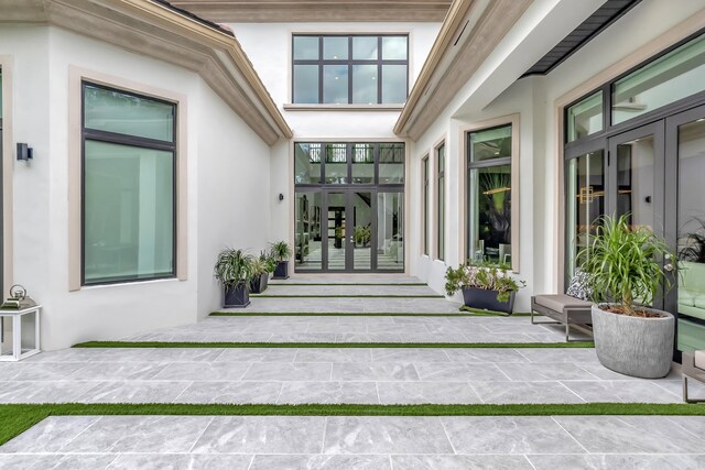 property entrance with french doors and a patio area