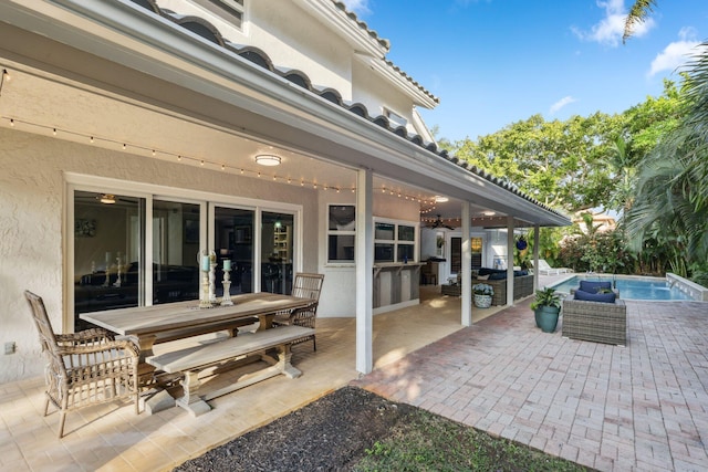 view of patio with ceiling fan, outdoor lounge area, area for grilling, an outdoor pool, and outdoor dining space