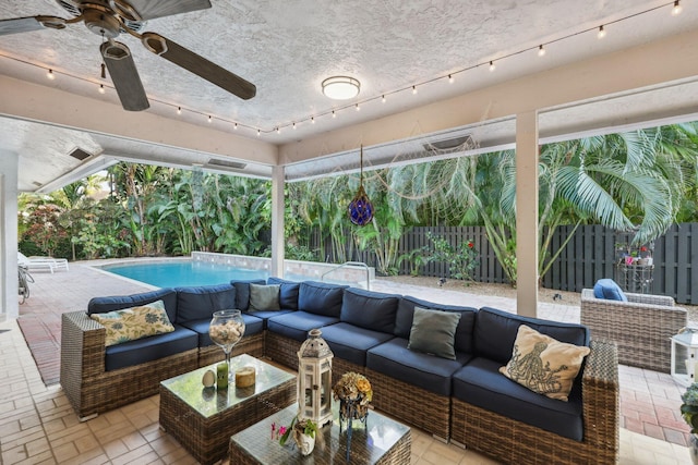 exterior space with ceiling fan