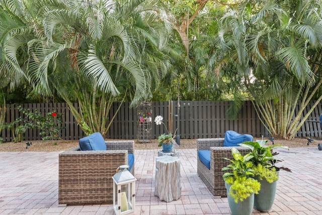 view of patio / terrace featuring fence