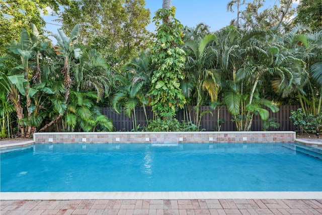 view of swimming pool featuring a fenced backyard