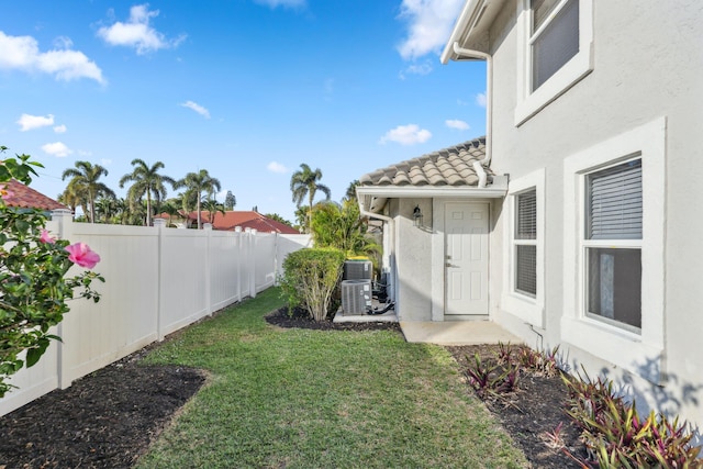 view of yard with cooling unit and a fenced backyard