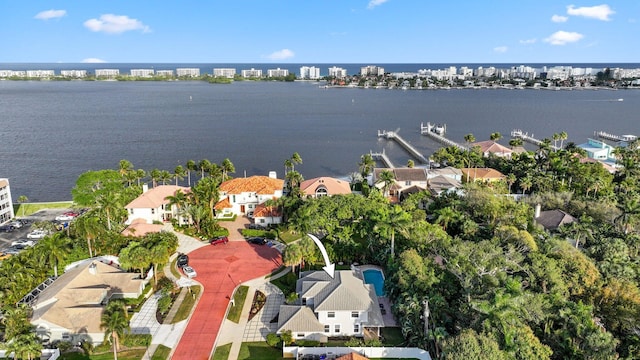 drone / aerial view with a residential view and a water view