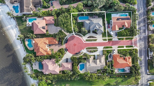 birds eye view of property with a residential view