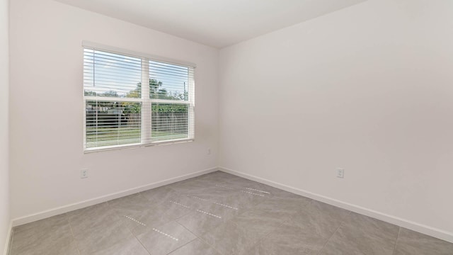 tiled empty room with plenty of natural light