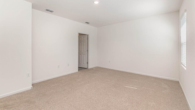 empty room featuring carpet flooring