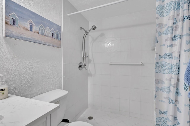 bathroom with curtained shower, toilet, and vanity