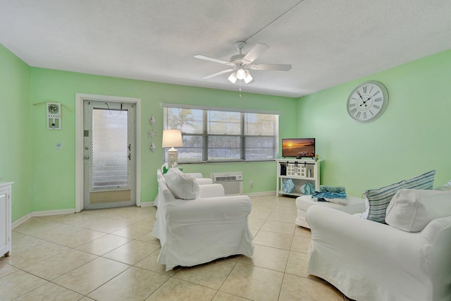 tiled living room featuring a textured ceiling and ceiling fan