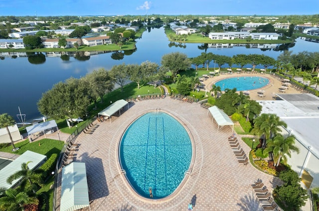 view of swimming pool featuring a water view