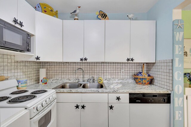 kitchen with decorative backsplash, white cabinetry, white appliances, and sink