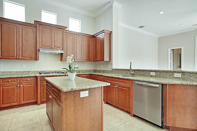 kitchen with sink, light stone countertops, ornamental molding, a kitchen island, and stainless steel appliances