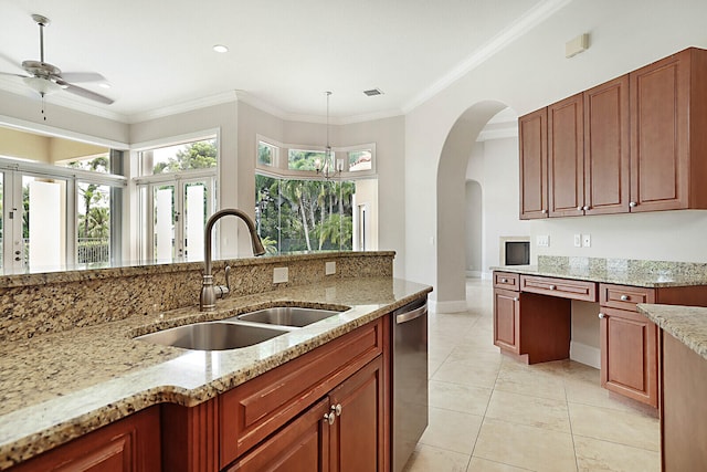 kitchen featuring sink, hanging light fixtures, light stone countertops, and light tile patterned flooring