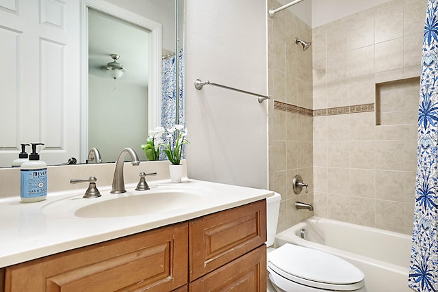 full bathroom featuring vanity, toilet, and shower / bath combination with curtain