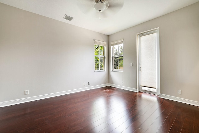 unfurnished room with dark hardwood / wood-style floors and ceiling fan