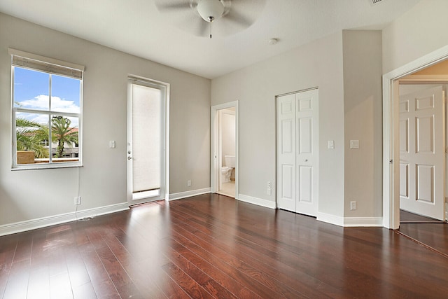 unfurnished bedroom with dark hardwood / wood-style floors and ceiling fan