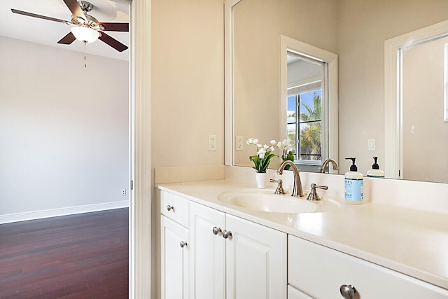 bathroom with vanity, hardwood / wood-style flooring, and ceiling fan