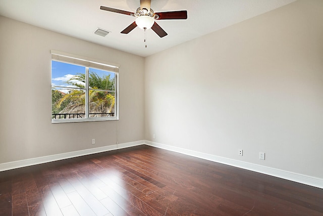 empty room featuring dark hardwood / wood-style floors and ceiling fan