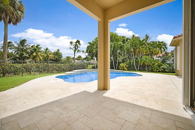 view of swimming pool featuring a patio and a jacuzzi