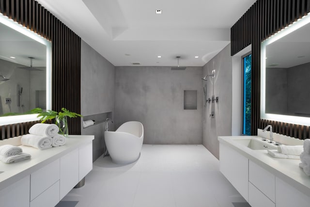 bathroom featuring vanity and separate shower and tub