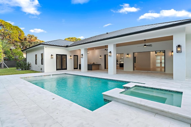 view of pool with an in ground hot tub, ceiling fan, and a patio