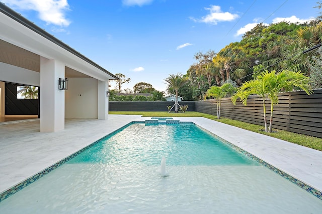 view of swimming pool with an in ground hot tub and a patio