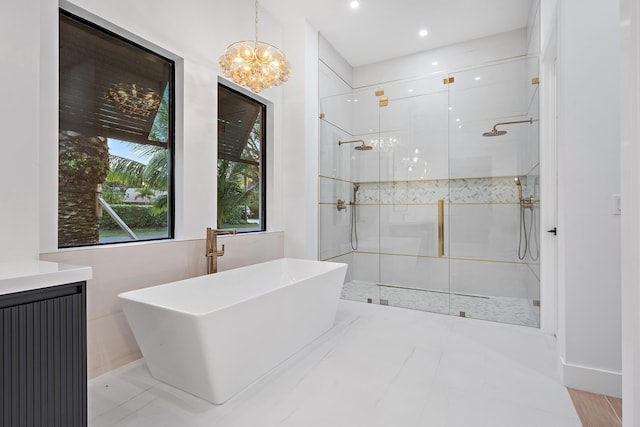 bathroom with separate shower and tub and a chandelier