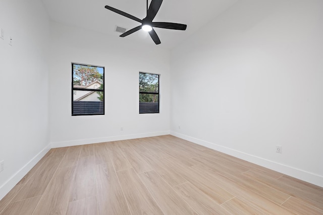 unfurnished room with ceiling fan and light wood-type flooring