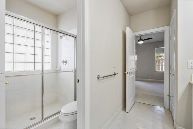 bathroom featuring walk in shower, tile patterned floors, ceiling fan, and toilet