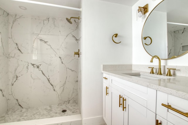 bathroom featuring vanity and a tile shower