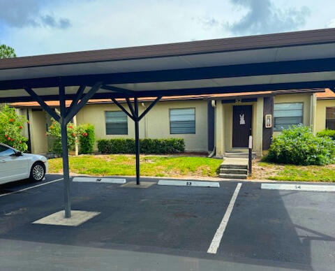 view of parking featuring a carport