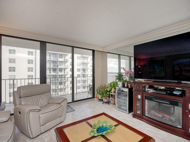 tiled living room featuring a textured ceiling, beverage cooler, and a wall of windows