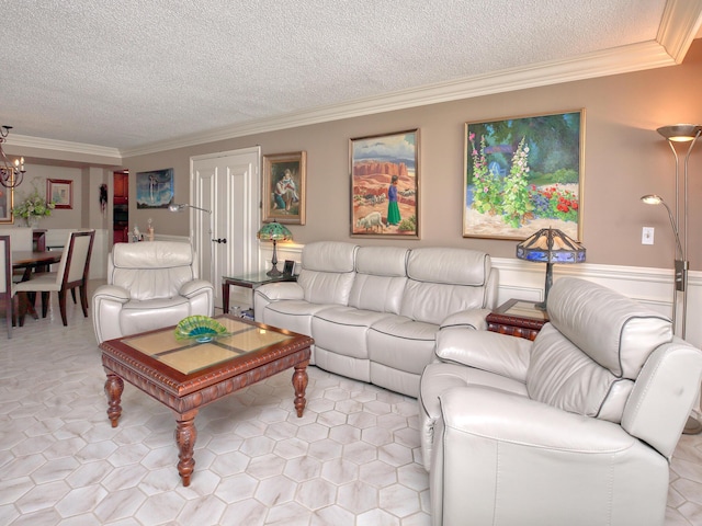 living room with ornamental molding, a textured ceiling, and an inviting chandelier