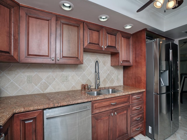 kitchen featuring tasteful backsplash, stainless steel appliances, sink, ceiling fan, and ornamental molding