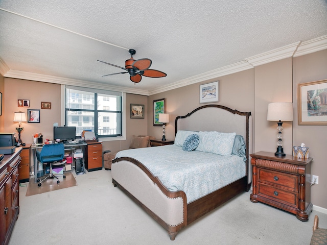 bedroom with carpet, ceiling fan, ornamental molding, and a textured ceiling