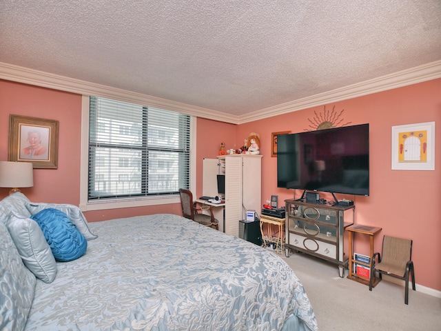 carpeted bedroom with ornamental molding and a textured ceiling