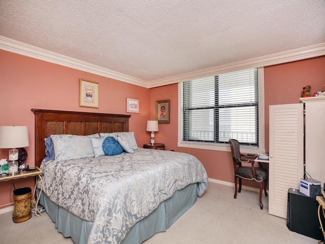 carpeted bedroom featuring ornamental molding and a textured ceiling