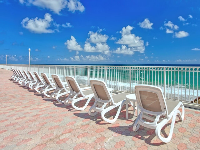 view of patio with a water view