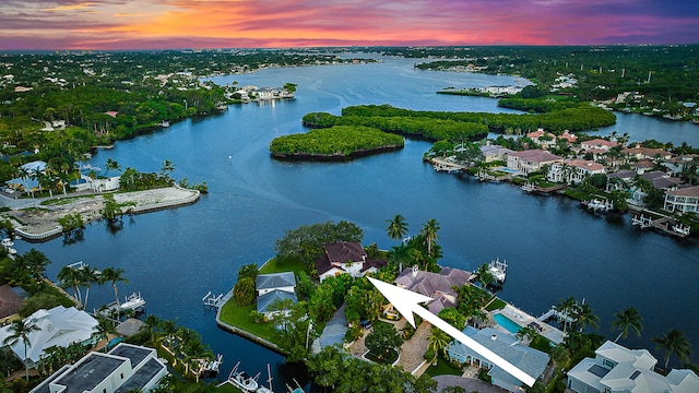 aerial view at dusk with a water view