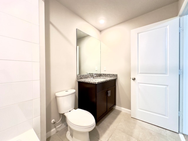 bathroom with tile patterned flooring, toilet, and vanity