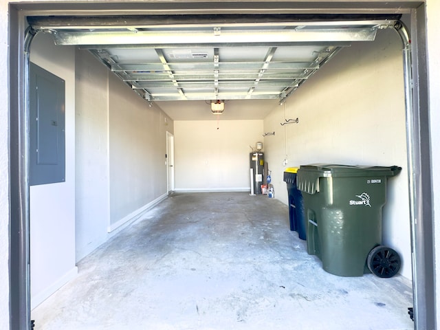 garage featuring electric water heater, electric panel, and a garage door opener