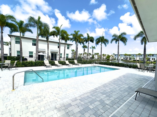 view of swimming pool featuring a patio area