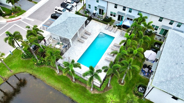 birds eye view of property with a water view