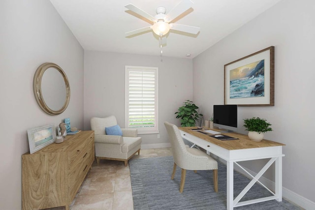 home office featuring a ceiling fan and baseboards