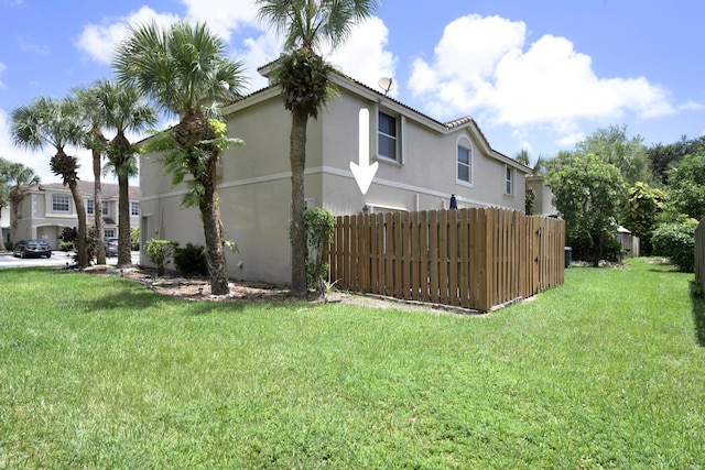 view of home's exterior featuring a lawn