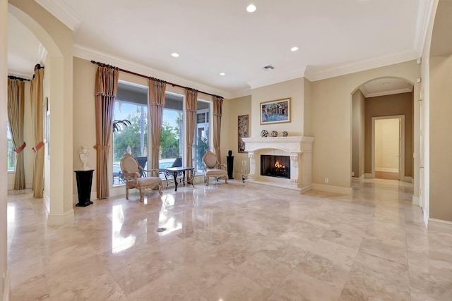 unfurnished living room featuring ornamental molding